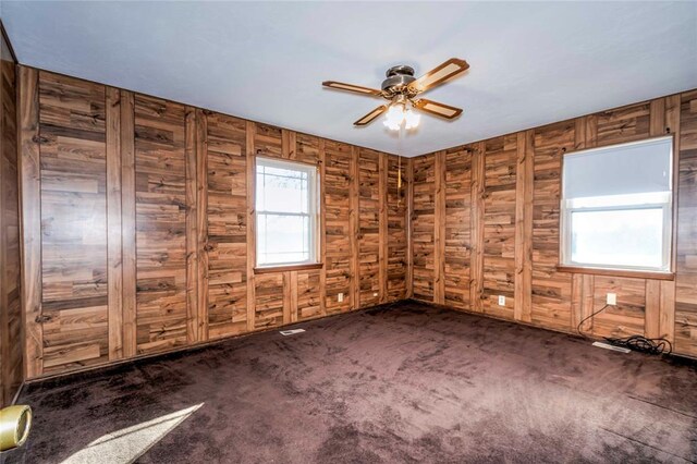 920173 S 3450th Rd, Chandler, OK 74834 - spare room with ceiling fan, carpet, and wood walls