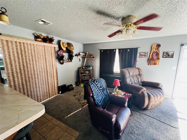 tiled living room with a textured ceiling