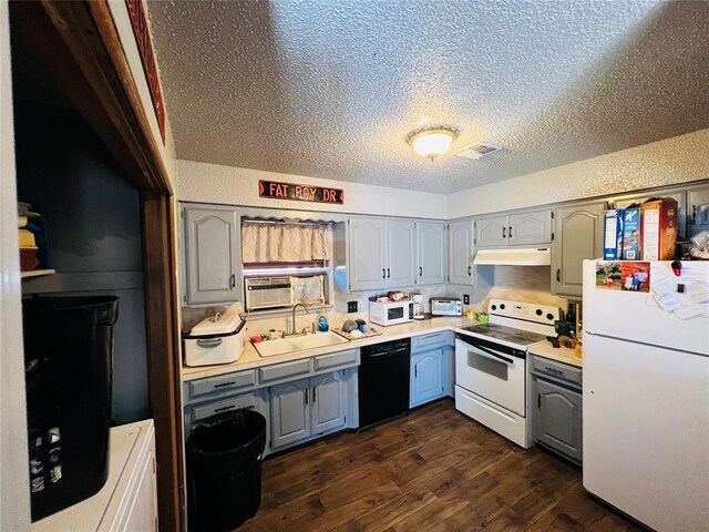 kitchen featuring white appliances, dark hardwood / wood-style floors, gray cabinetry, and sink