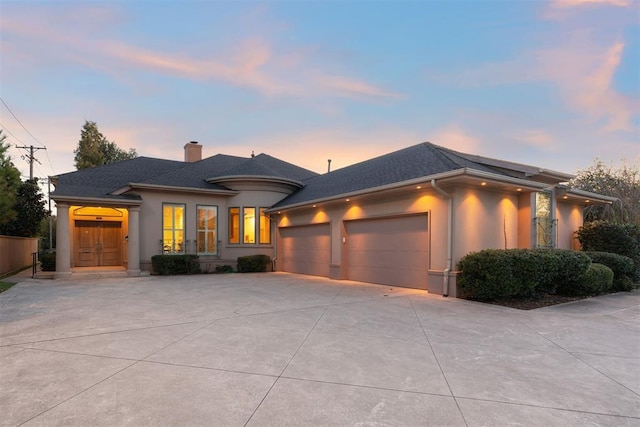 prairie-style house featuring a garage