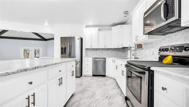 kitchen with sink, stainless steel appliances, tasteful backsplash, crown molding, and white cabinets