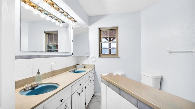 bathroom featuring tile patterned flooring and vanity