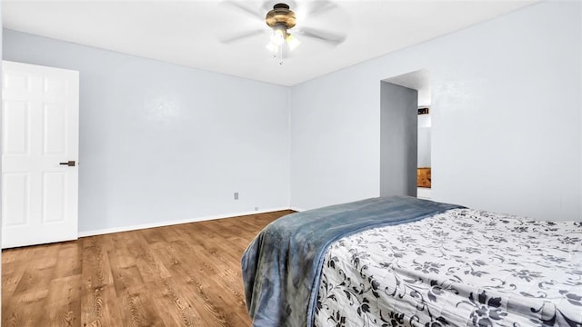 bedroom featuring ceiling fan and wood-type flooring