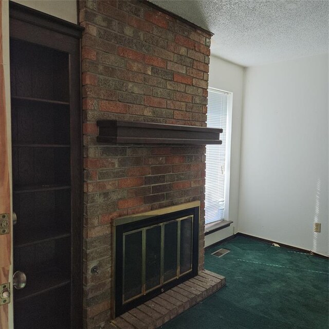 4727 NW 72nd St, Oklahoma City, OK 73132 - detailed view of a fireplace, carpet, and a textured ceiling