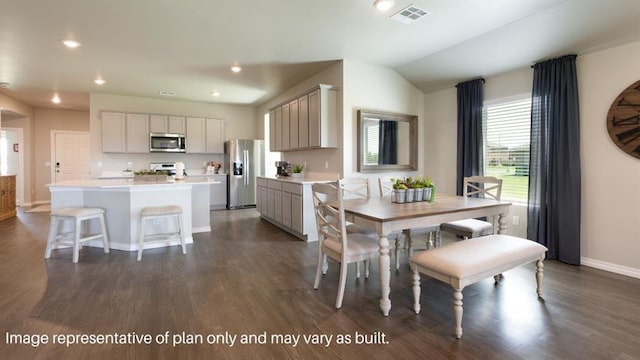 dining space with lofted ceiling, recessed lighting, dark wood-style flooring, visible vents, and baseboards