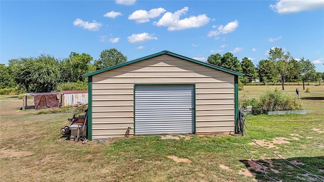 view of outbuilding with a lawn