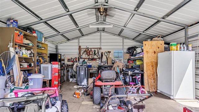 garage featuring white fridge