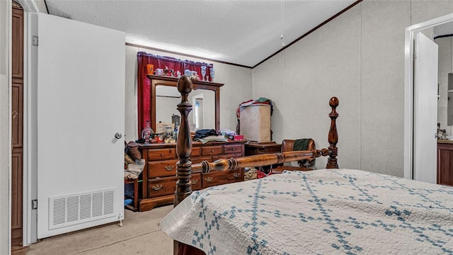 bedroom with a textured ceiling and lofted ceiling