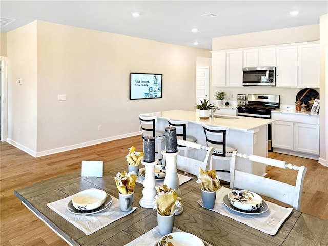 dining room with light hardwood / wood-style floors