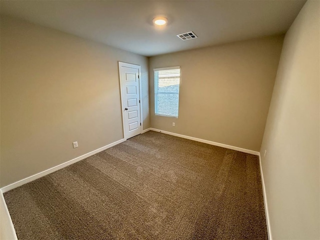 spare room with carpet floors