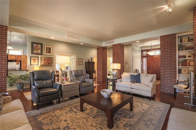 living room with dark hardwood / wood-style floors