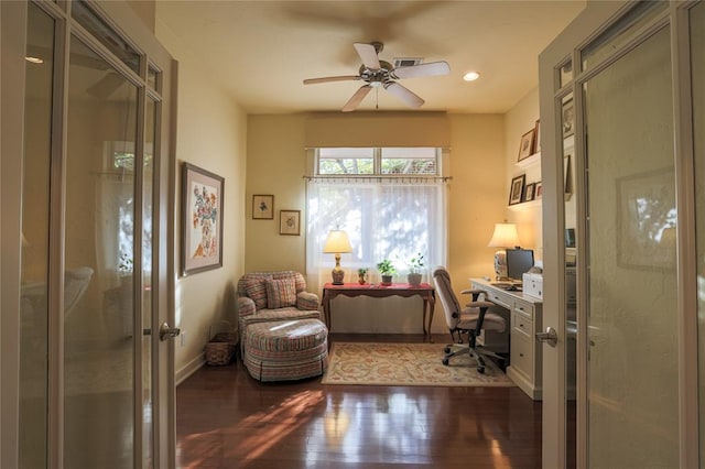 home office featuring ceiling fan, dark hardwood / wood-style flooring, and french doors