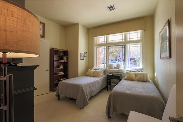 bedroom with light colored carpet