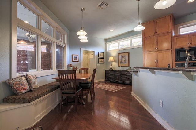 dining room with dark wood-type flooring