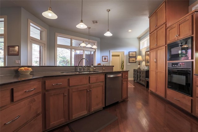 kitchen featuring hanging light fixtures, dark wood-type flooring, sink, and black appliances