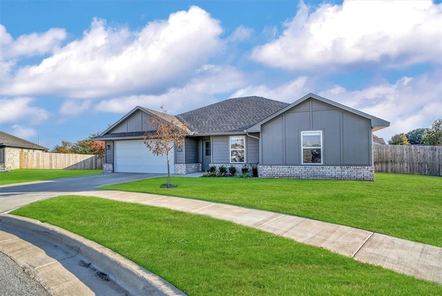 ranch-style house with a garage and a front lawn