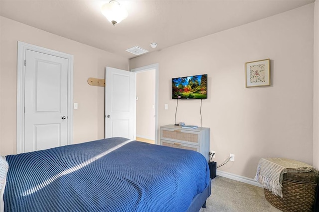 bedroom featuring light colored carpet