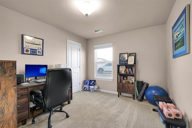 office area featuring light carpet