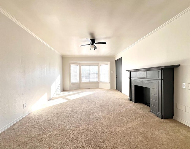 unfurnished living room with a tile fireplace, light colored carpet, ceiling fan, and crown molding