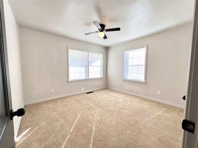 carpeted empty room with ceiling fan