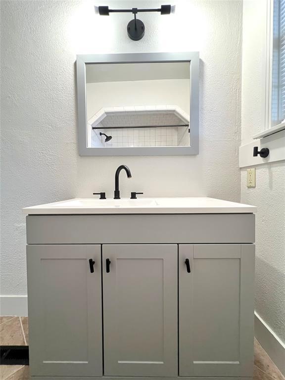 bathroom featuring tile patterned floors and vanity