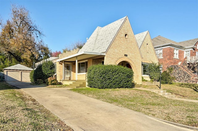 view of front facade with a garage and an outdoor structure