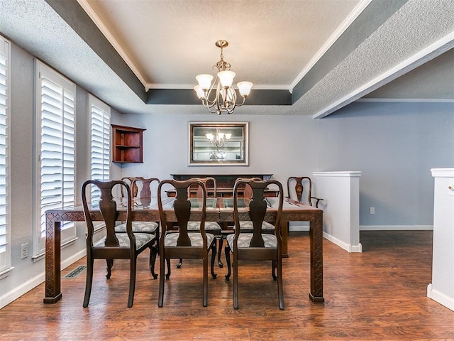 dining space featuring a raised ceiling, crown molding, dark hardwood / wood-style flooring, and a notable chandelier