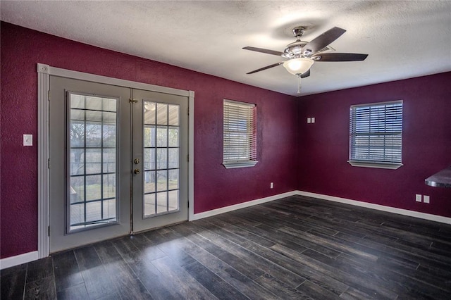 interior space featuring french doors, dark hardwood / wood-style flooring, a textured ceiling, and ceiling fan