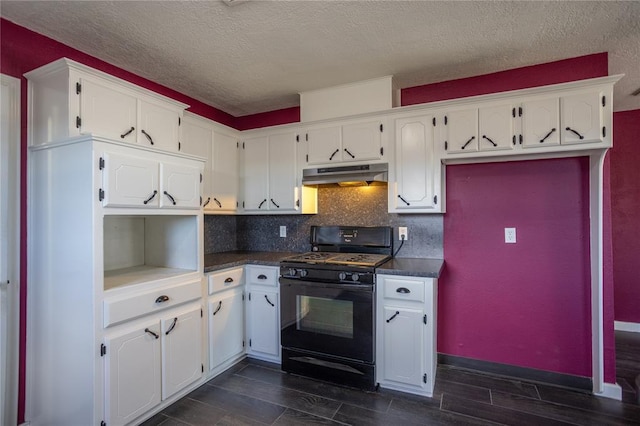 kitchen with gas stove, decorative backsplash, white cabinets, and a textured ceiling