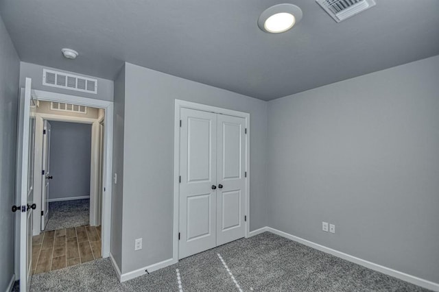 unfurnished bedroom with a closet and carpet