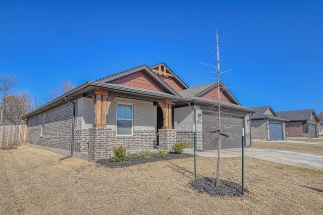 view of front of property with a porch and a garage