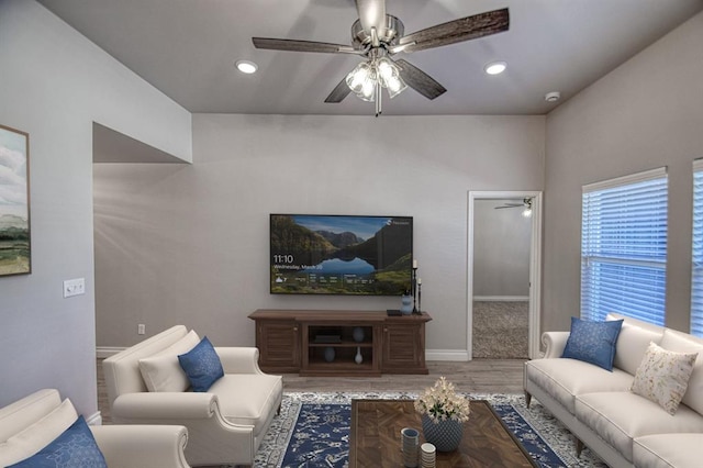 living room with hardwood / wood-style flooring and ceiling fan