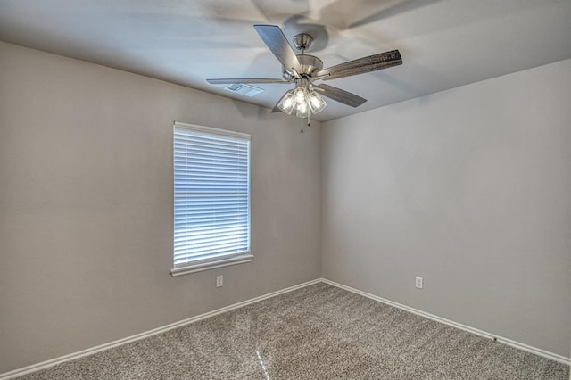 empty room featuring carpet floors and ceiling fan