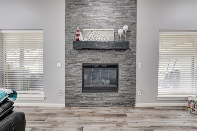 living room with a fireplace and hardwood / wood-style flooring