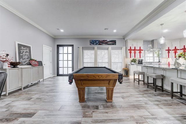 recreation room featuring light hardwood / wood-style flooring, crown molding, and billiards