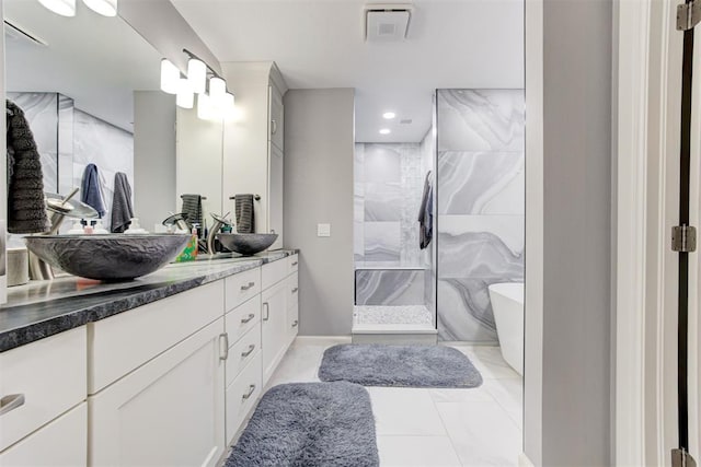 bathroom featuring vanity and plus walk in shower