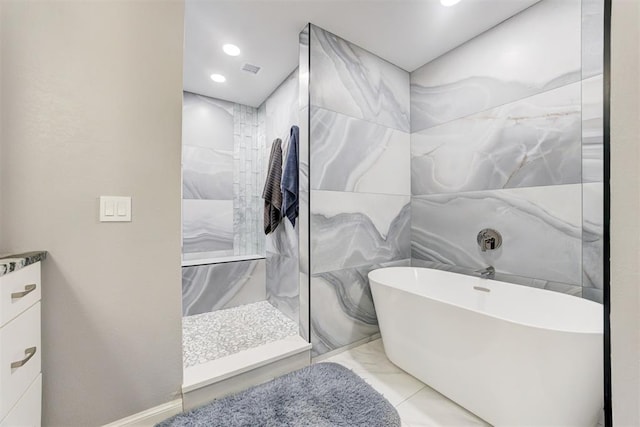 bathroom with shower with separate bathtub