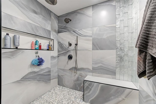 bathroom with a tile shower