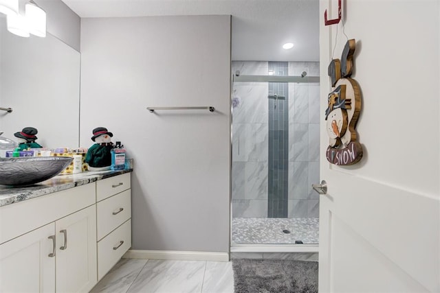 bathroom with vanity and a shower with door