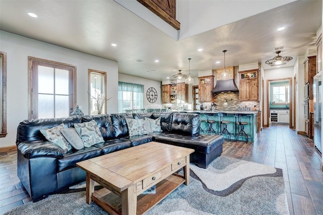 living room with dark hardwood / wood-style floors and a wealth of natural light