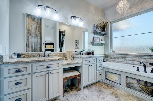 bathroom with a bathtub and vanity