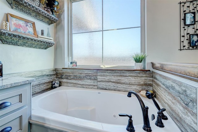 bathroom with a bath and vanity