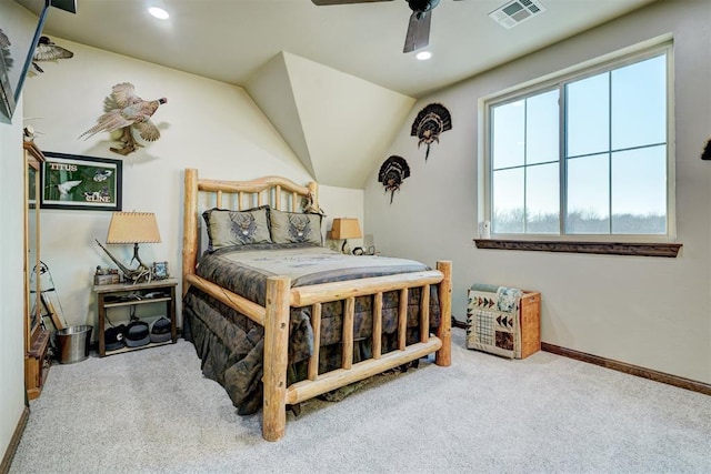 carpeted bedroom with ceiling fan and vaulted ceiling