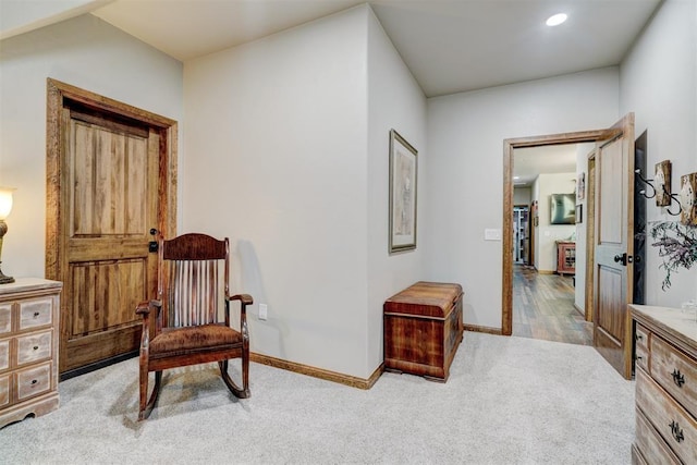 sitting room with light hardwood / wood-style flooring