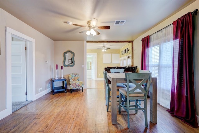 dining room featuring hardwood / wood-style flooring and ceiling fan