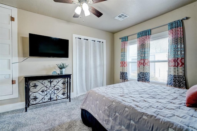 carpeted bedroom featuring ceiling fan