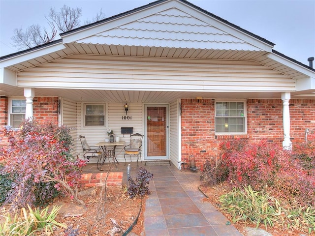 view of front of house with a porch and a patio