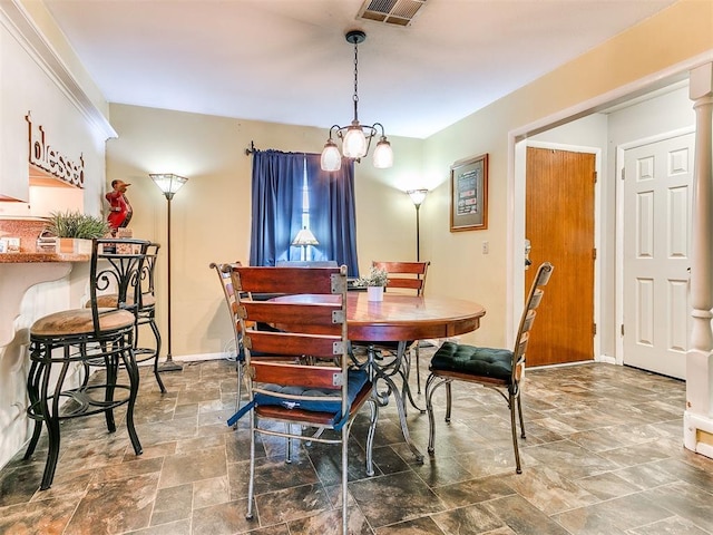 dining space featuring an inviting chandelier