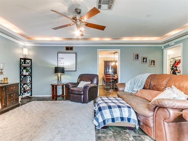 carpeted living room featuring ceiling fan and crown molding