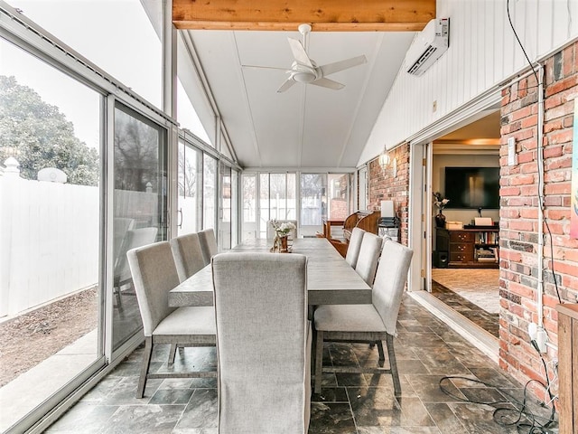 sunroom featuring ceiling fan, lofted ceiling with beams, plenty of natural light, and a wall mounted air conditioner